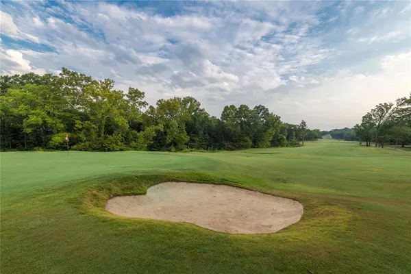 a view of a golf course with a garden