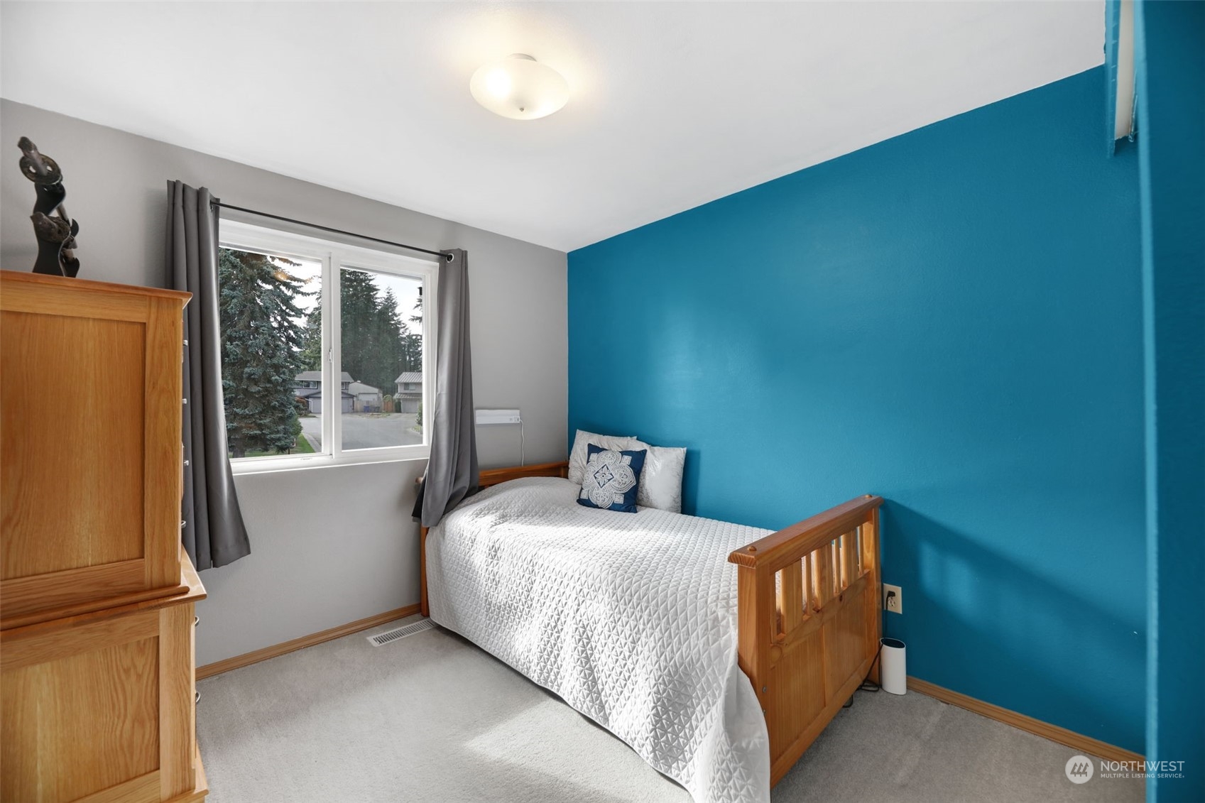 525 222nd Street Southwest Bothell, WA 98021 - Photo 11 of 25 a bedroom with a bed and wooden floor