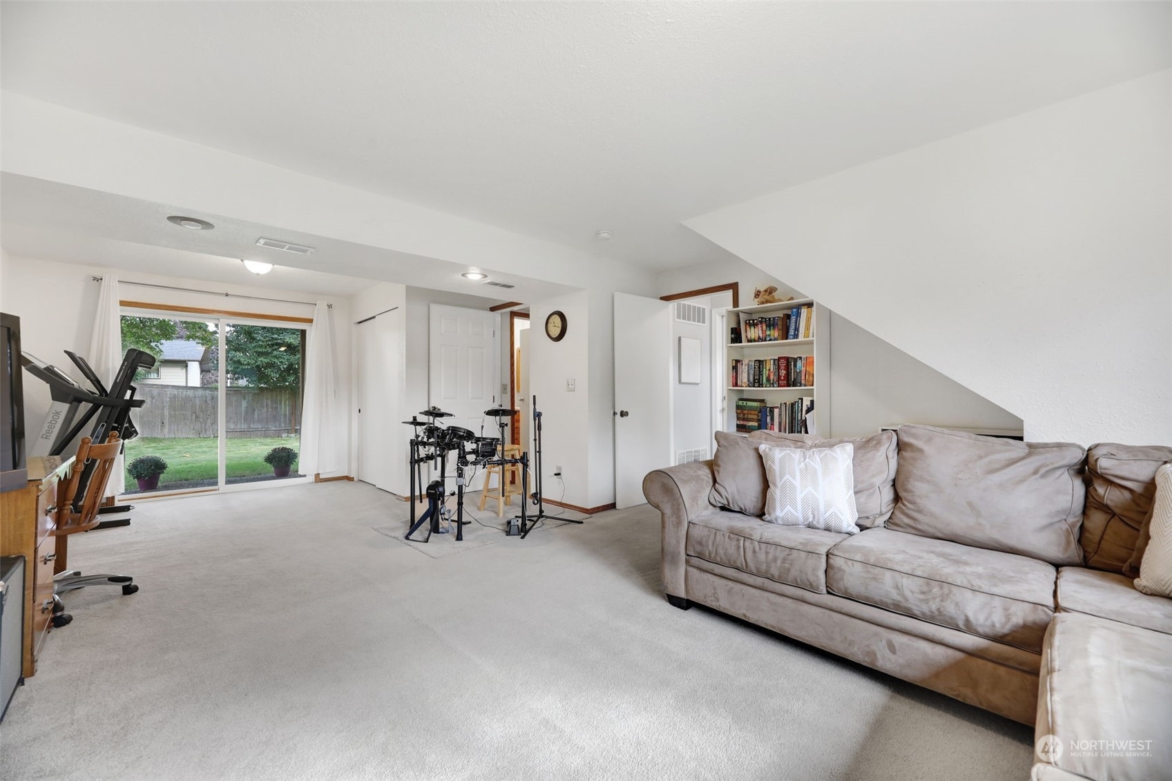 525 222nd Street Southwest Bothell, WA 98021 - Photo 18 of 25 a living room with furniture and a floor to ceiling window