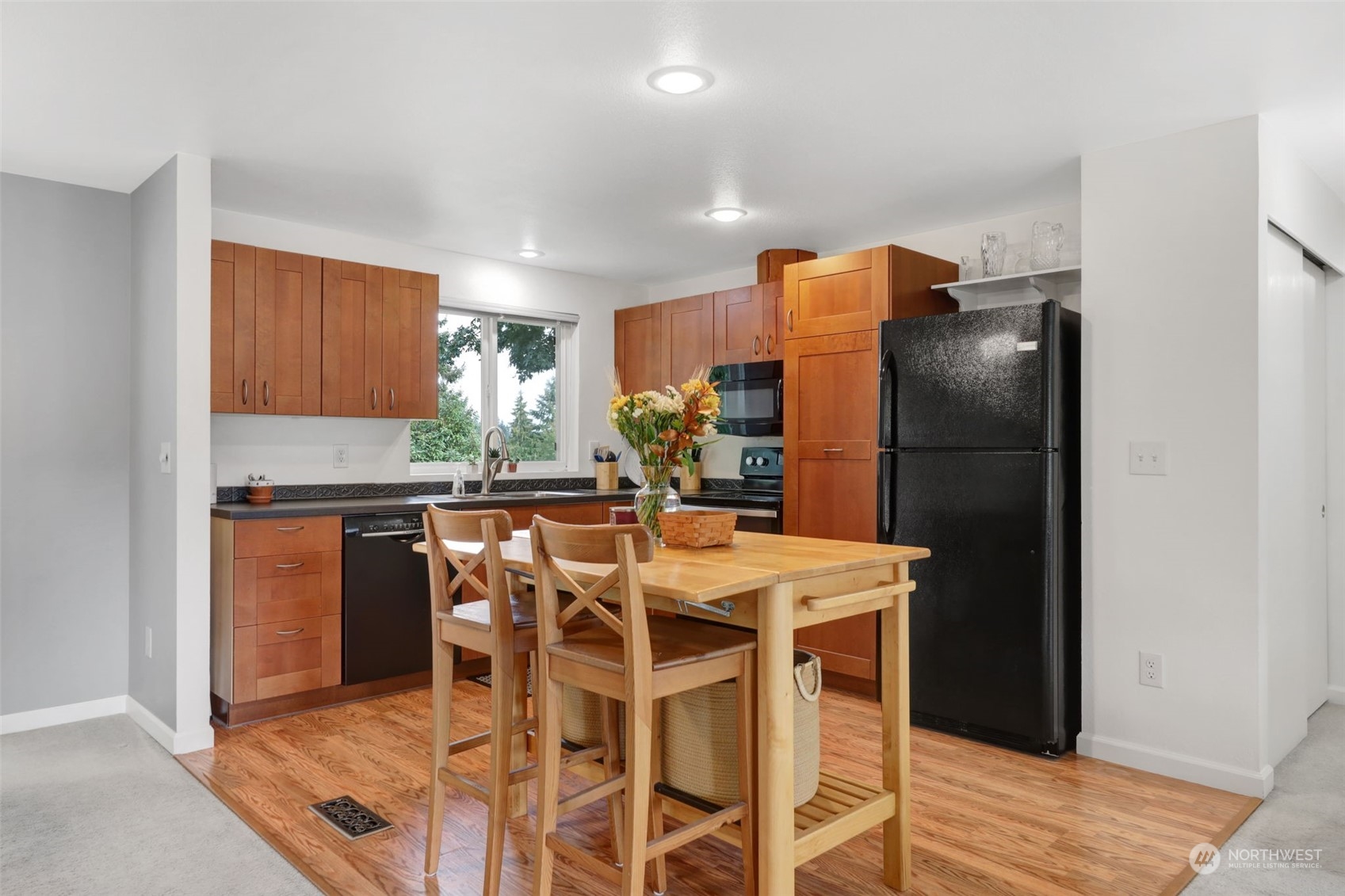525 222nd Street Southwest Bothell, WA 98021 - Photo 7 of 25 a kitchen with stainless steel appliances granite countertop a refrigerator and a stove top oven