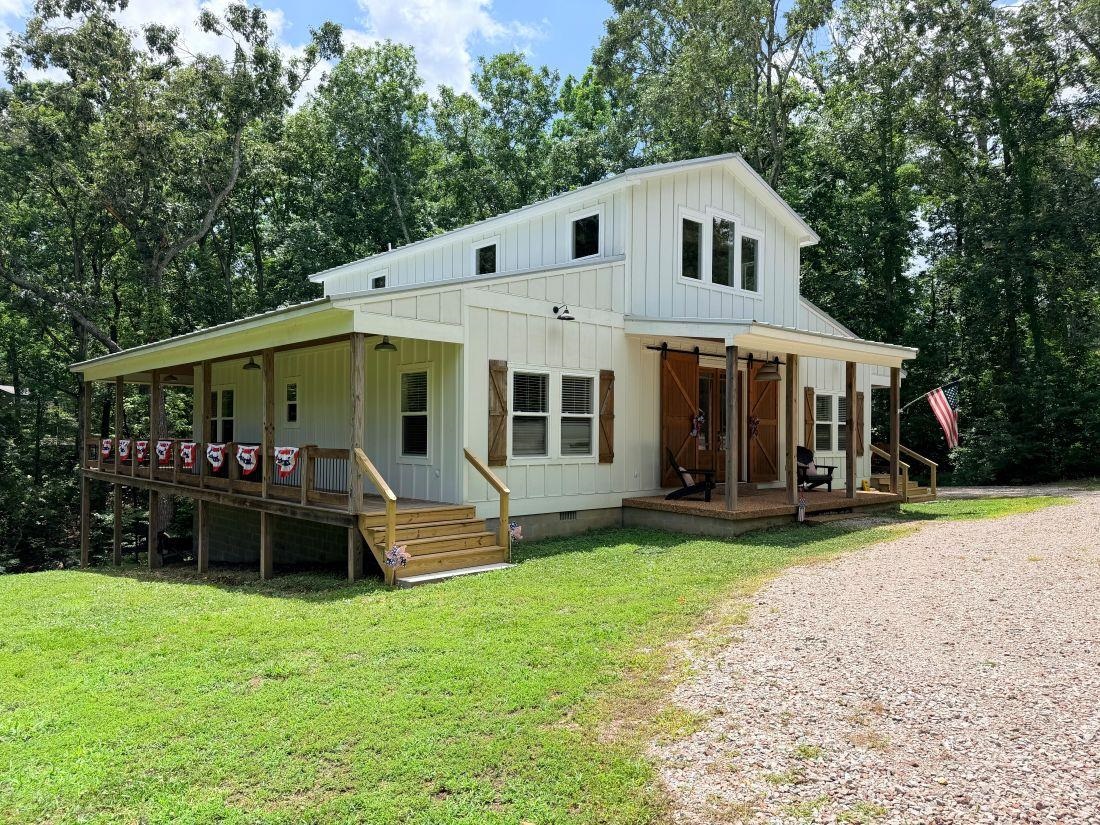 540 Muscatel Lane Counce, TN 38326 - Photo 2 of 32 a front view of a house with a yard porch and garden