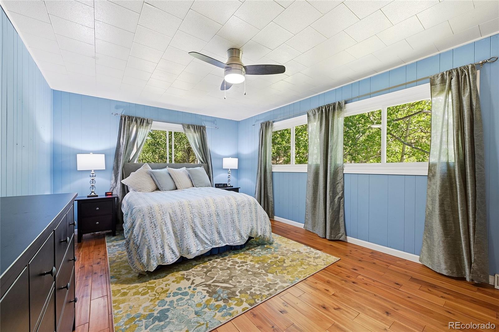 427 Brookside Drive Bailey, CO 80421 - Photo 27 of 37 a bedroom with a large bed and a window