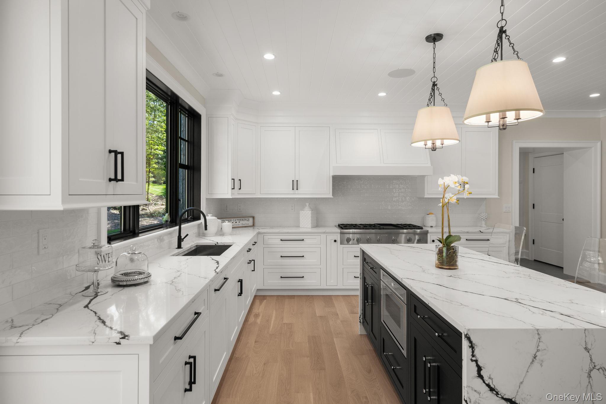 64 Saw Mill Road Cold Spring Harbor, NY 11724 - Photo 16 of 50 a kitchen with a sink stove and cabinets