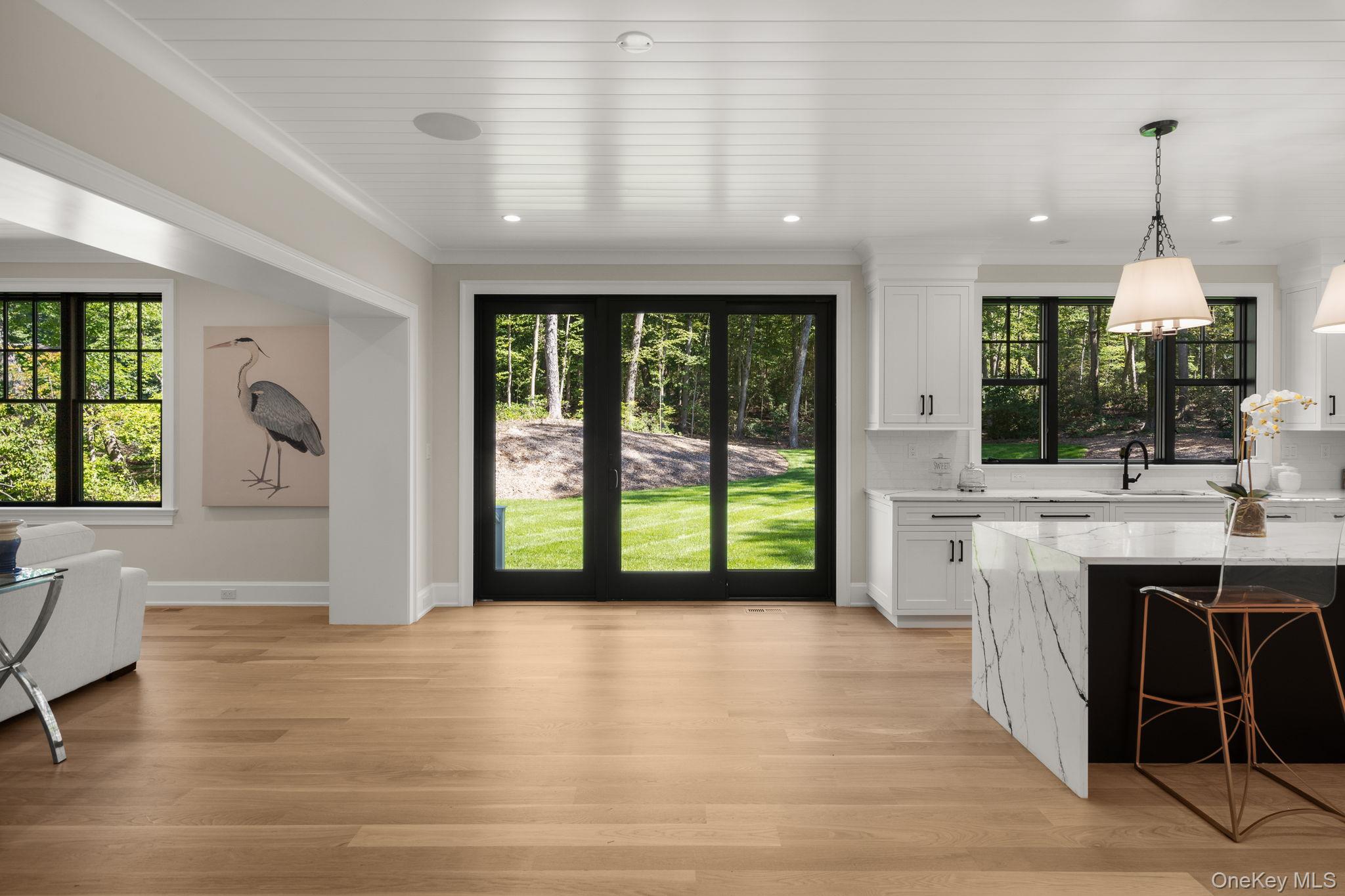 64 Saw Mill Road Cold Spring Harbor, NY 11724 - Photo 17 of 50 a view of an entryway with wooden floor and a front door