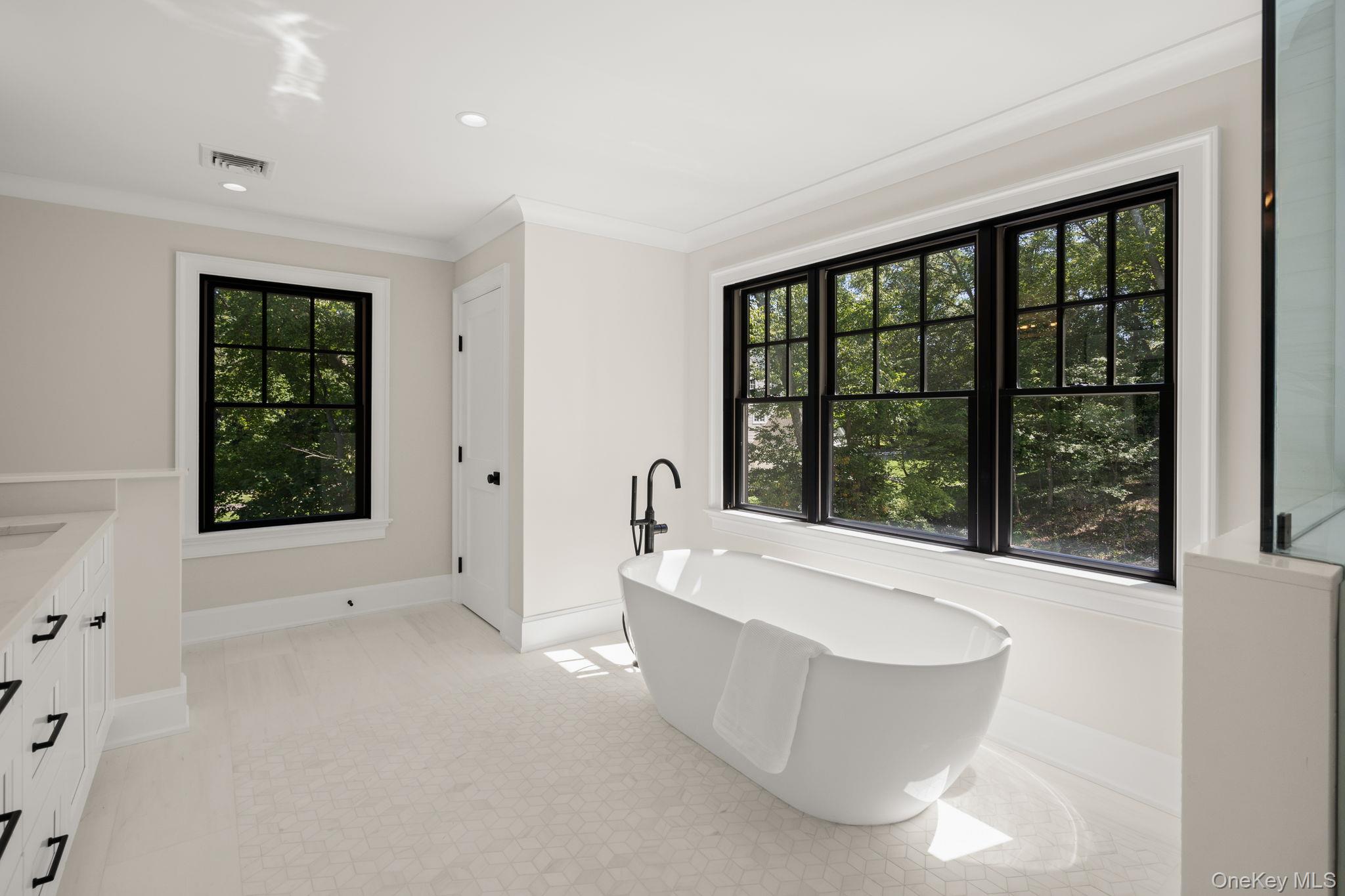 64 Saw Mill Road Cold Spring Harbor, NY 11724 - Photo 26 of 50 a view of an empty room with a large window