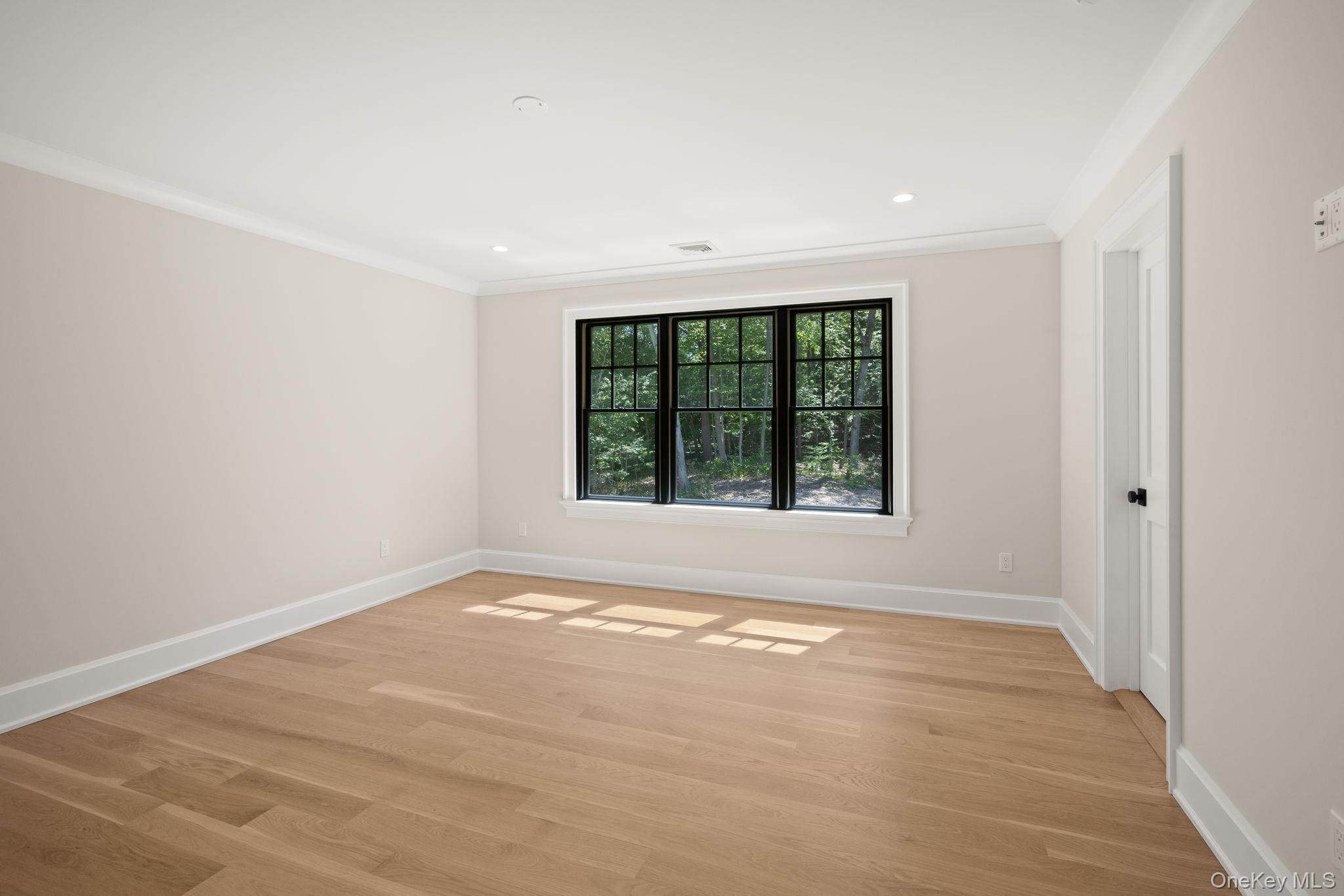 64 Saw Mill Road Cold Spring Harbor, NY 11724 - Photo 29 of 50 an empty room with a window