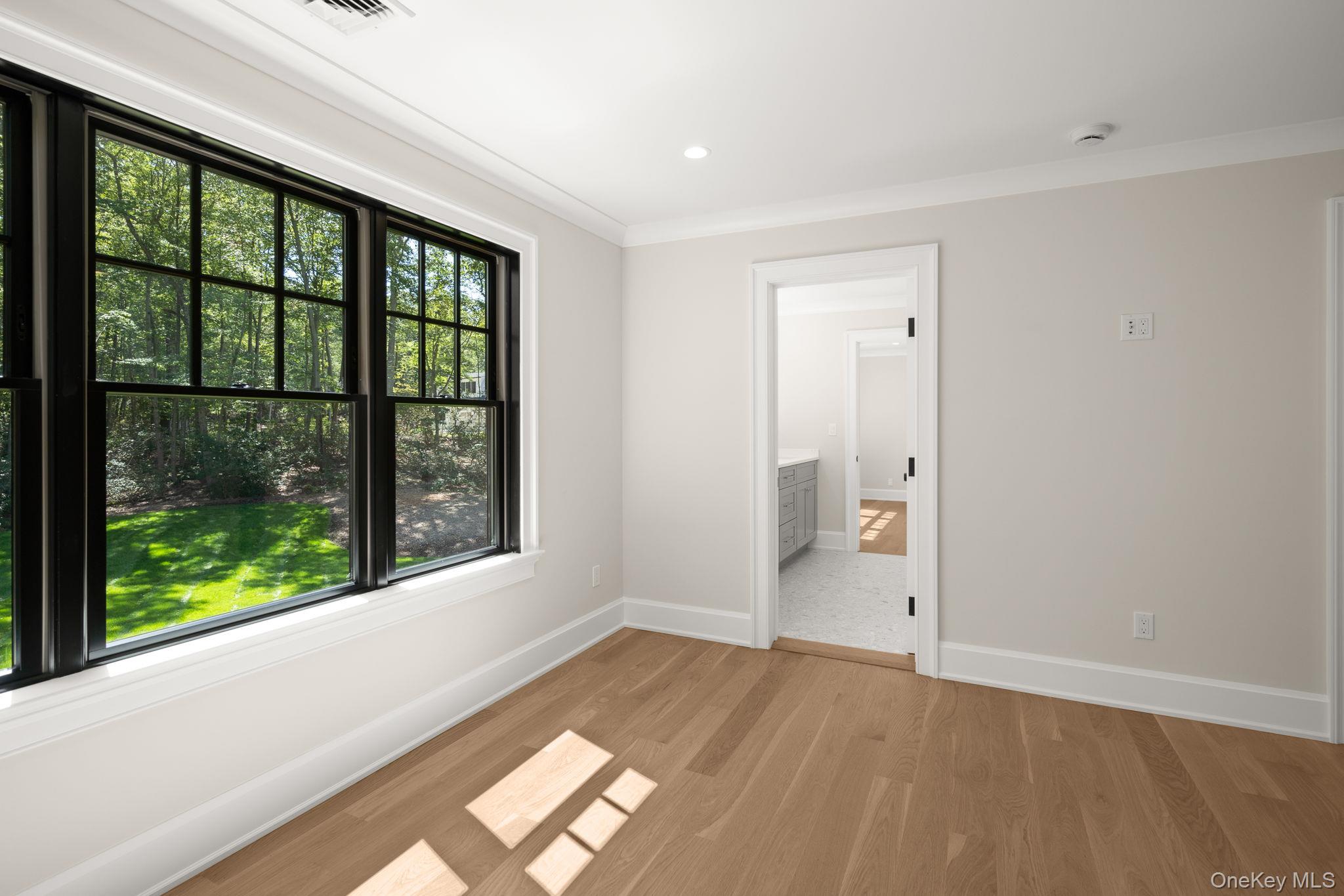 64 Saw Mill Road Cold Spring Harbor, NY 11724 - Photo 31 of 50 a view of an empty room with a window
