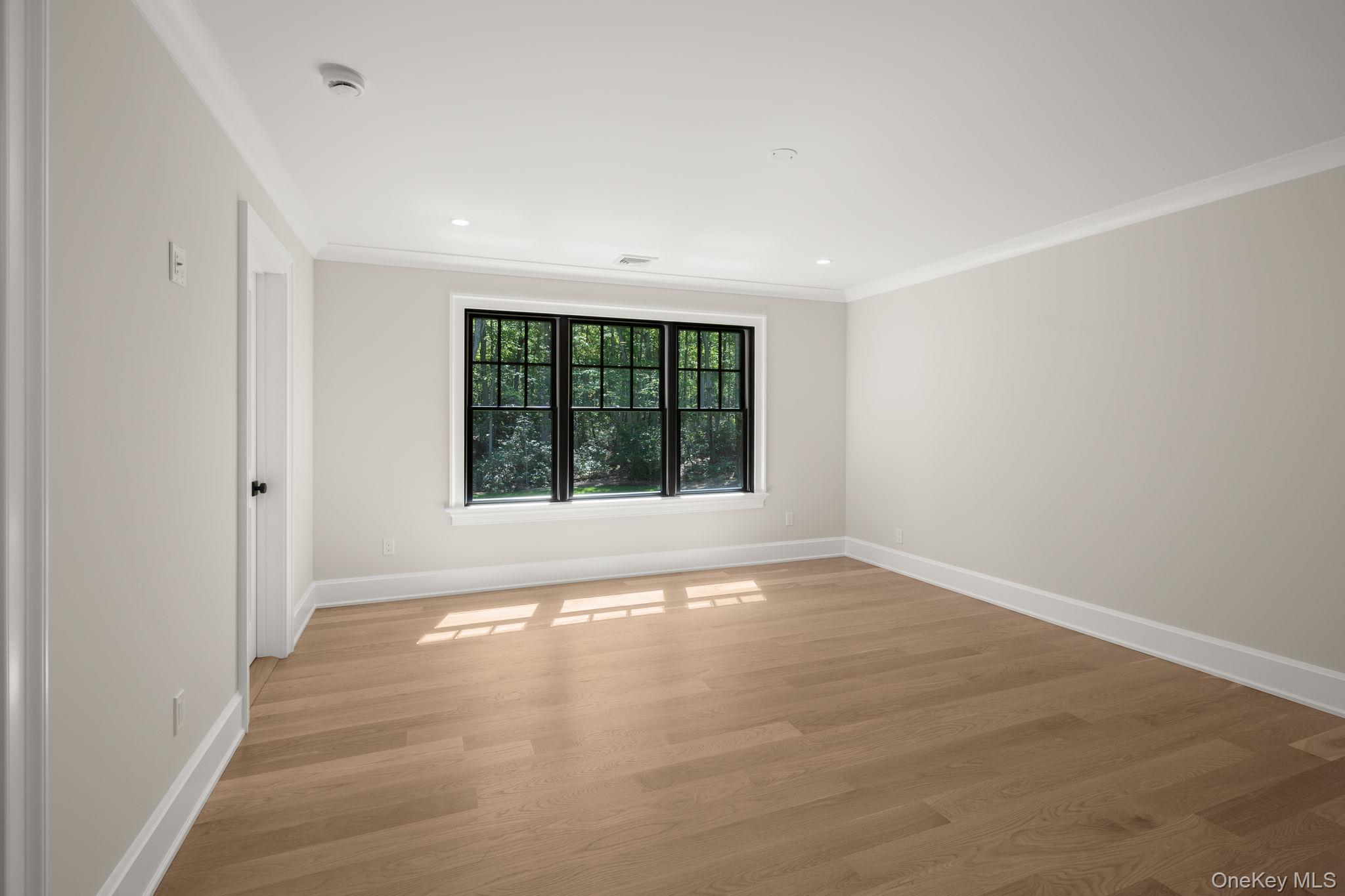 64 Saw Mill Road Cold Spring Harbor, NY 11724 - Photo 32 of 50 a view of an empty room with a window