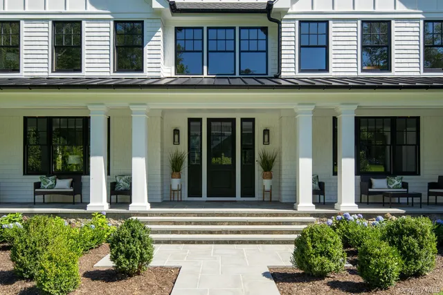 a front view of a building with a porch