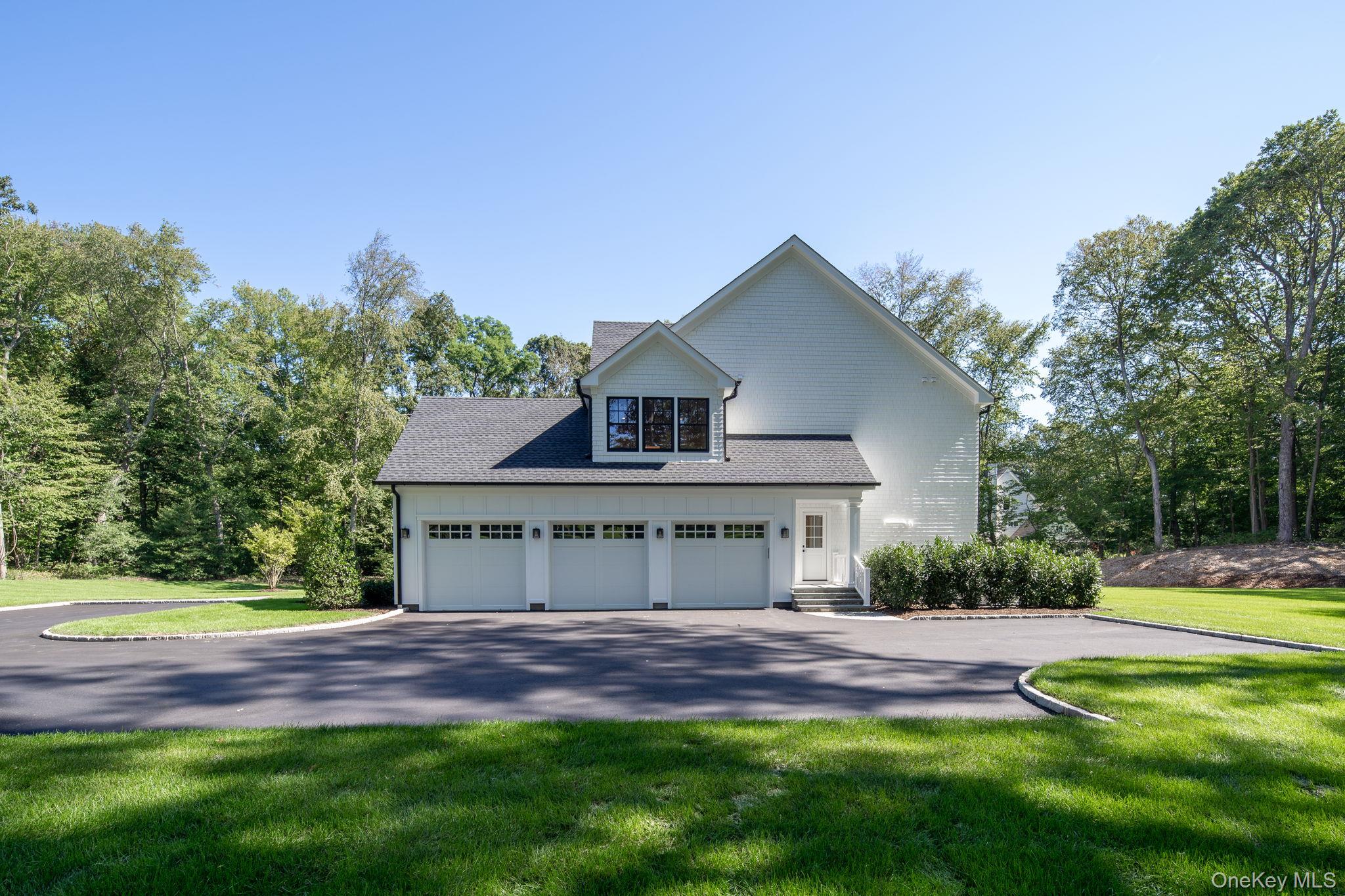 64 Saw Mill Road Cold Spring Harbor, NY 11724 - Photo 43 of 50 a front view of a house with a yard