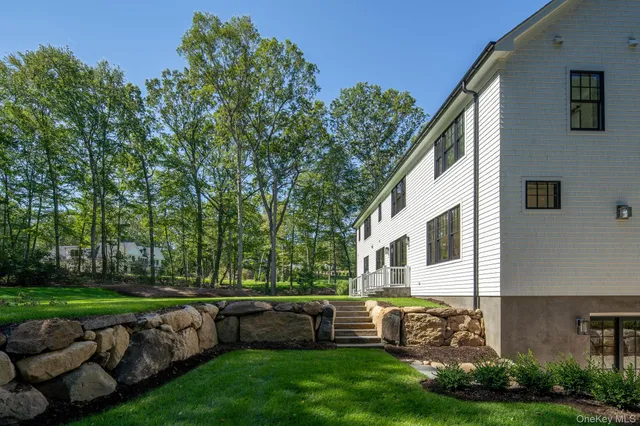 a view of house with backyard
