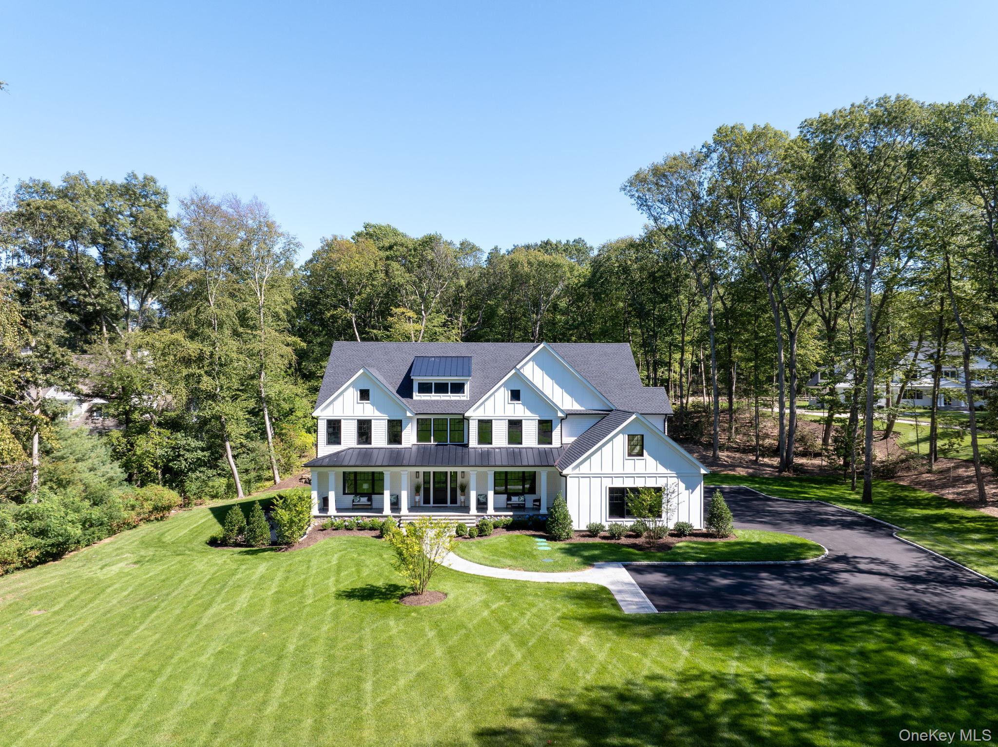 64 Saw Mill Road Cold Spring Harbor, NY 11724 - Photo 47 of 50 a front view of house with yard and green space