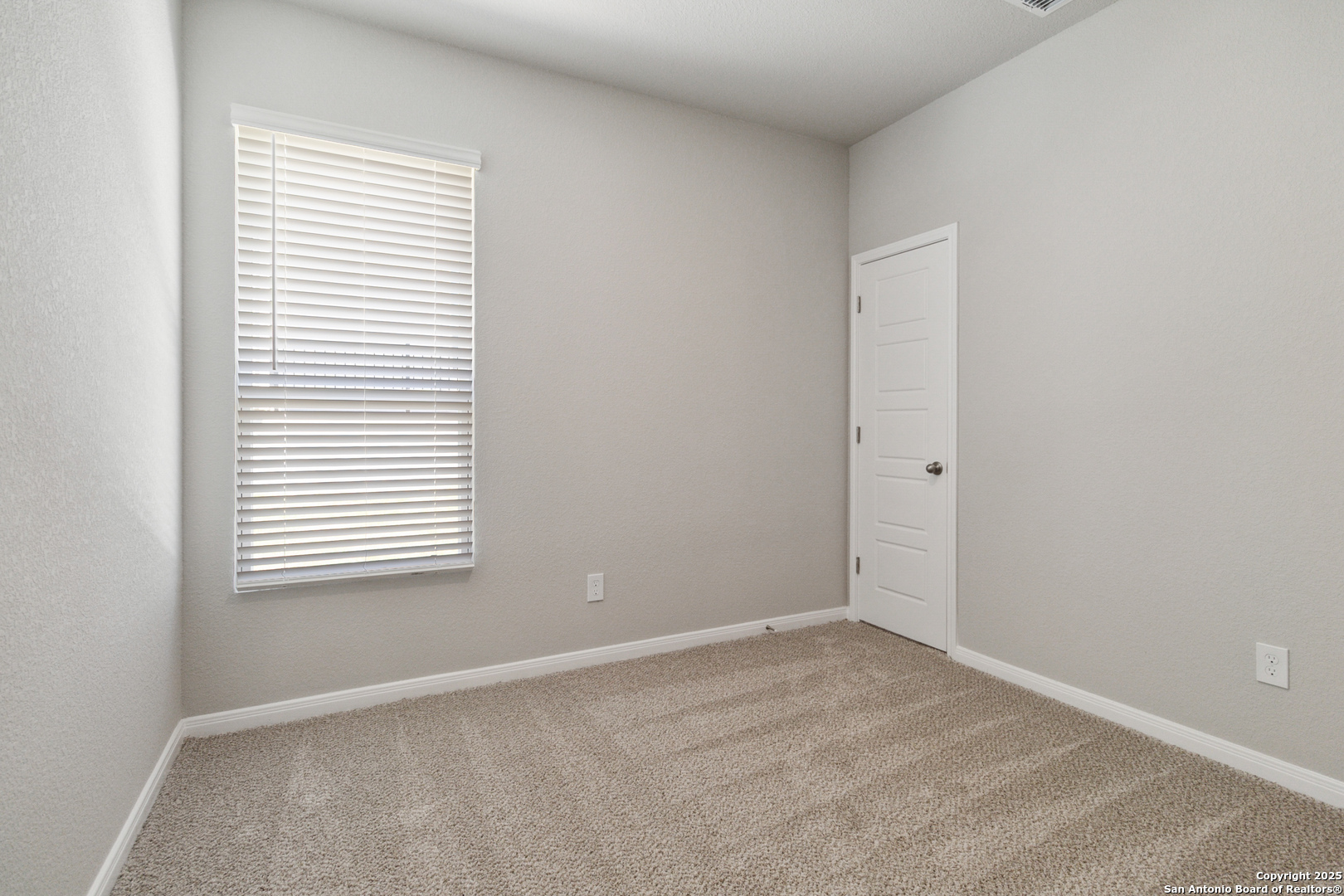 119 Gunner Road Buda, TX 78610 - Photo 25 of 30 an empty room with a window