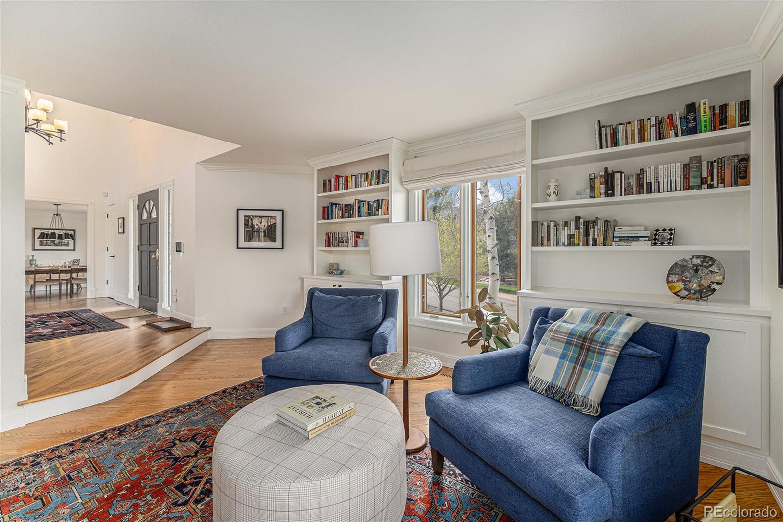 8 Blue Grouse Ridge Road Littleton, CO 80127 - Photo 16 of 49 a living room with furniture and a rug