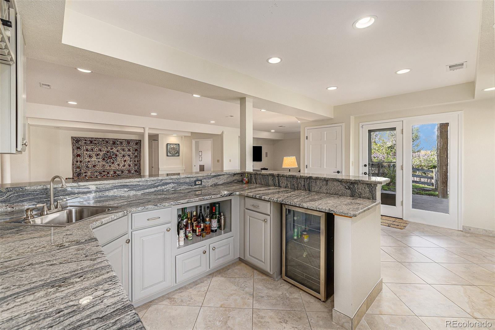 8 Blue Grouse Ridge Road Littleton, CO 80127 - Photo 32 of 49 a large kitchen with a stove and cabinets