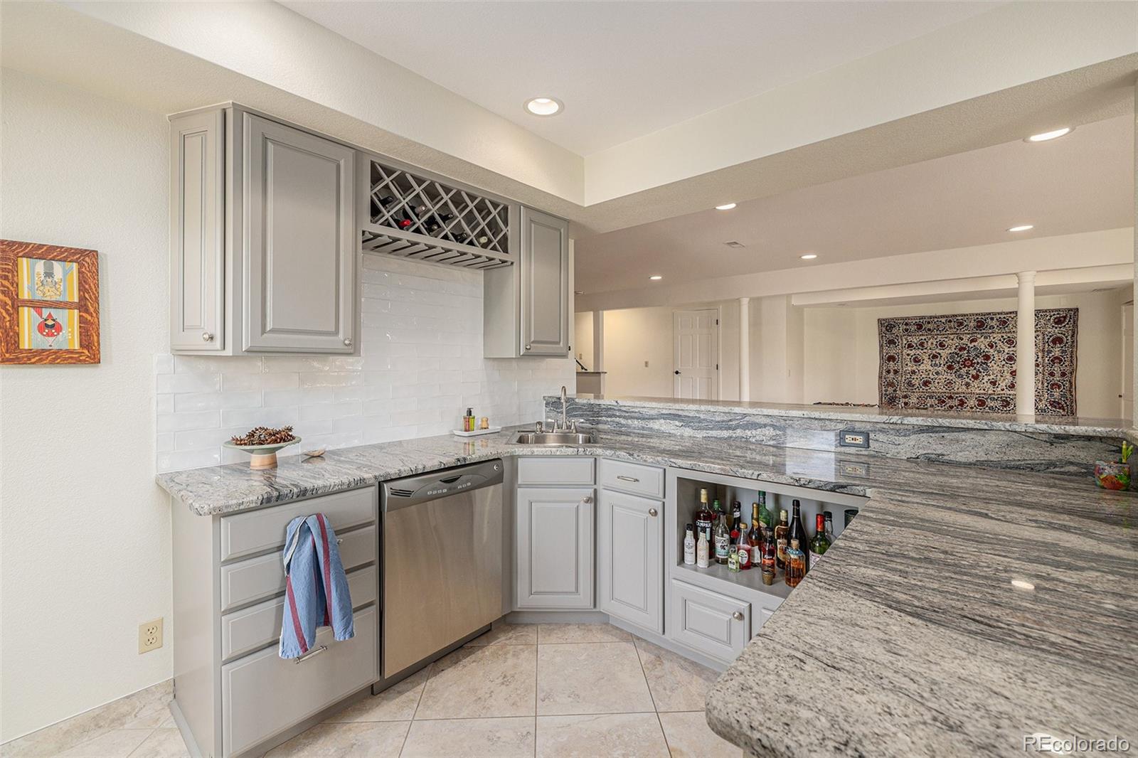 8 Blue Grouse Ridge Road Littleton, CO 80127 - Photo 33 of 49 a kitchen with a sink counter top space and cabinets