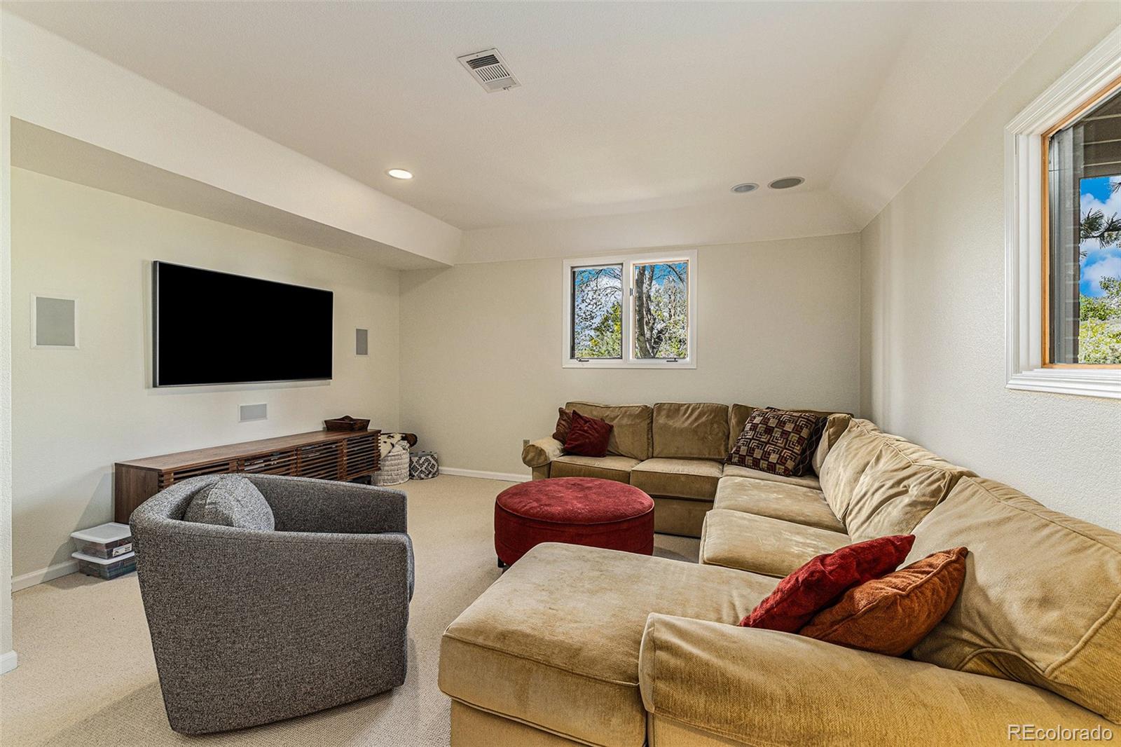 8 Blue Grouse Ridge Road Littleton, CO 80127 - Photo 34 of 49 a living room with furniture and a flat screen tv
