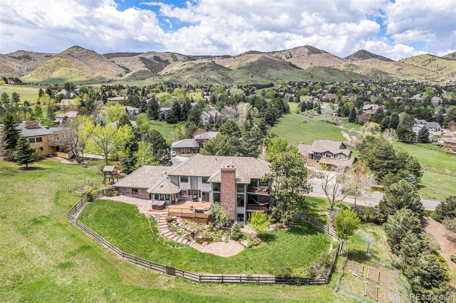 8 Blue Grouse Ridge Road Littleton, CO 80127 - Photo 43 of 49 an aerial view of residential houses with outdoor space and city view