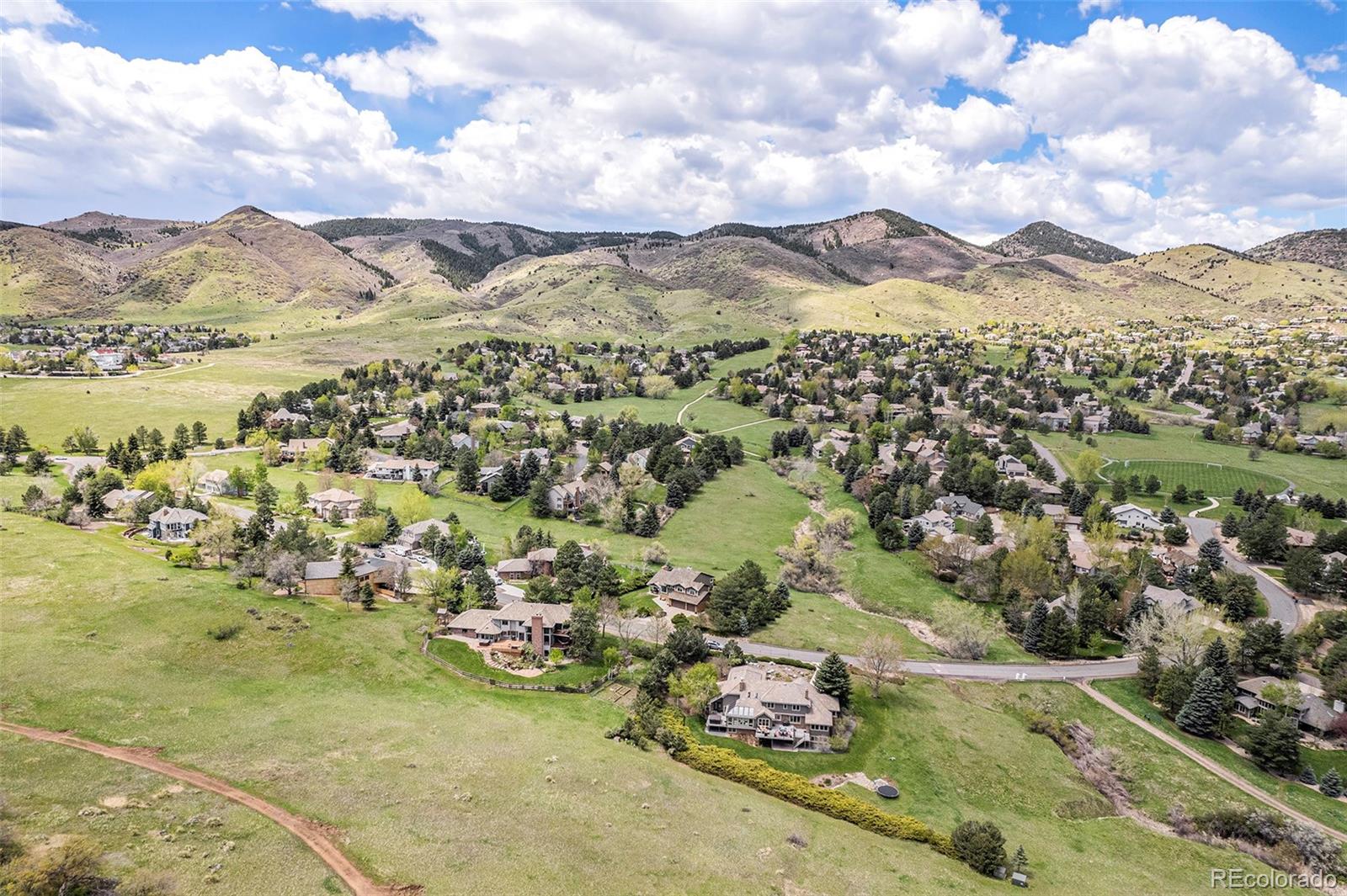 8 Blue Grouse Ridge Road Littleton, CO 80127 - Photo 46 of 49 a view of a city with mountains in the background