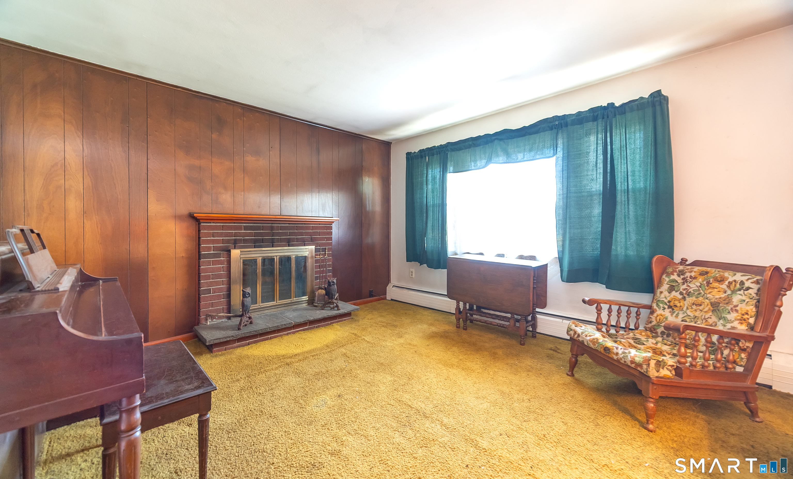127 Bee Street Meriden, CT 06450 - Photo 16 of 32 a bedroom with furniture and a fireplace