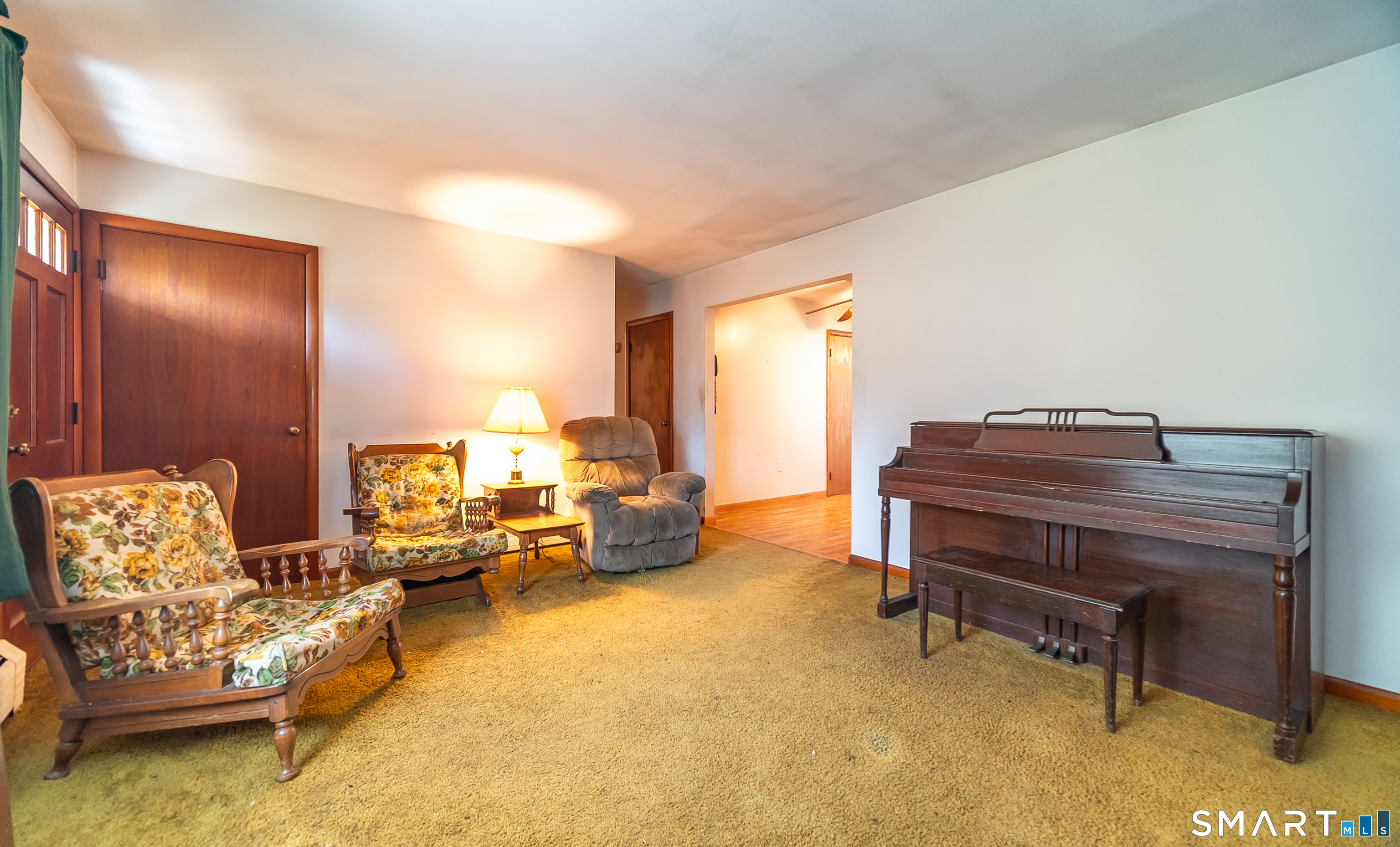 127 Bee Street Meriden, CT 06450 - Photo 17 of 32 a living room with furniture and a piano