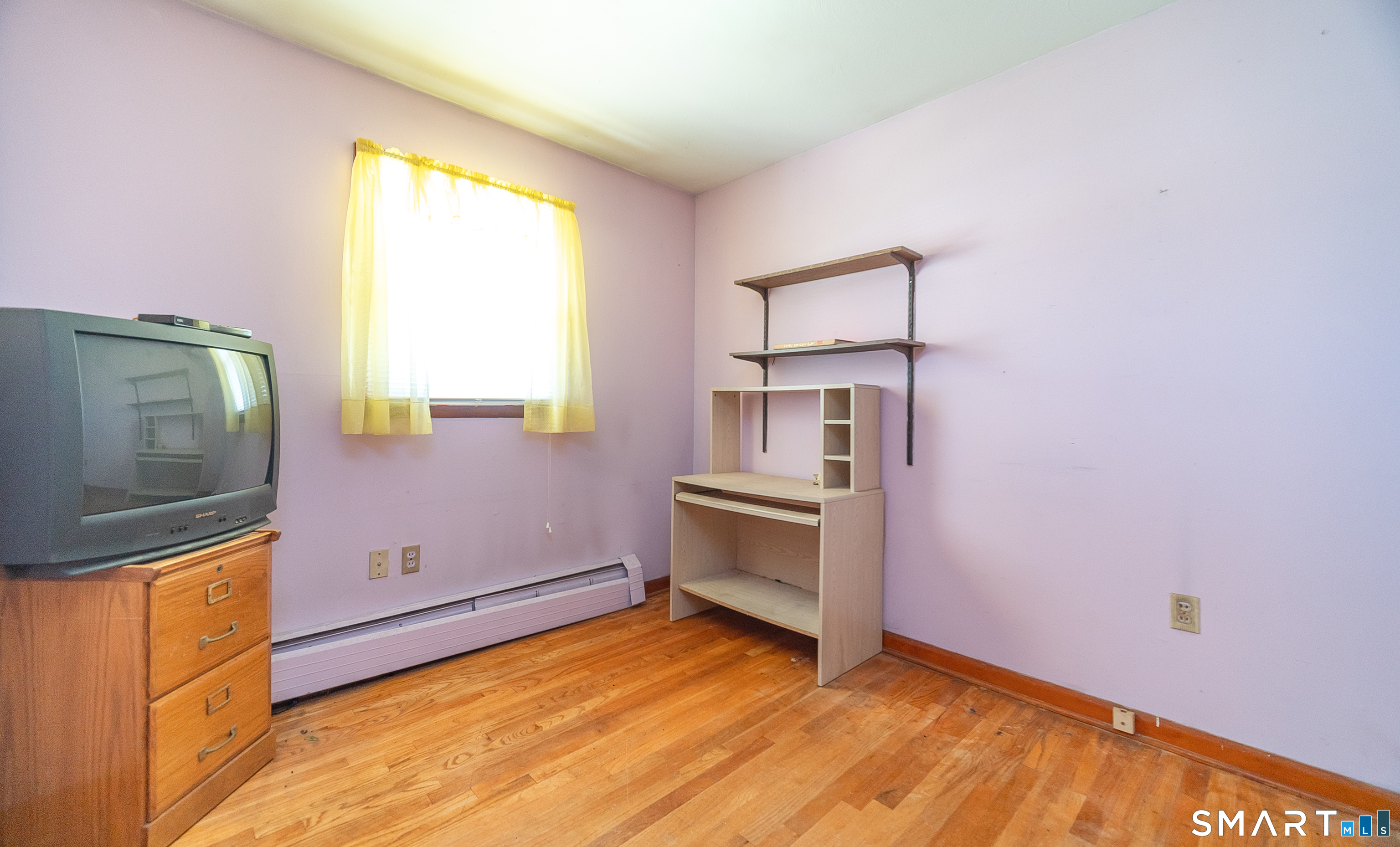 127 Bee Street Meriden, CT 06450 - Photo 19 of 32 a room with window and dresser