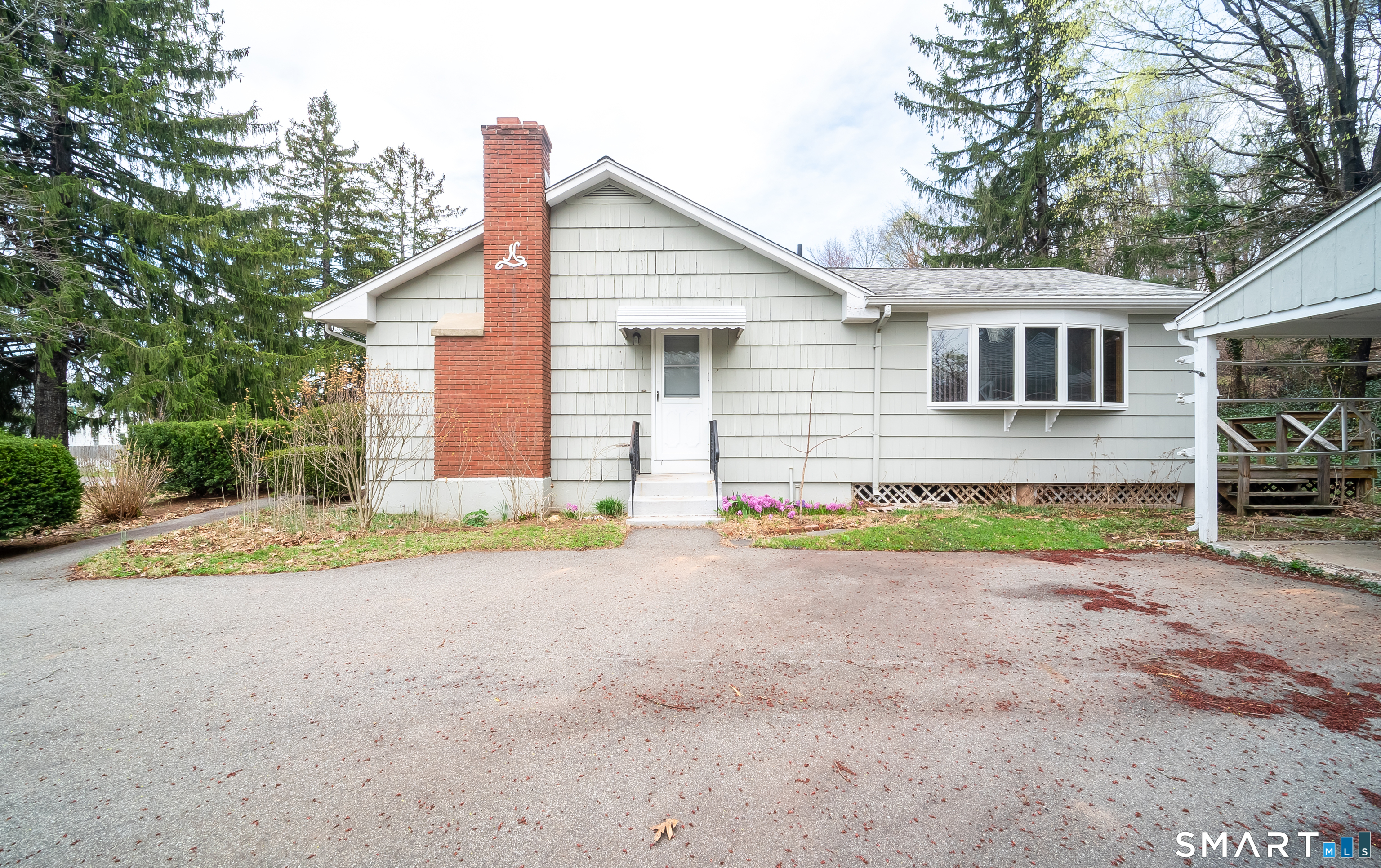 127 Bee Street Meriden, CT 06450 - Photo 2 of 32 a view of a house with a yard and sitting area
