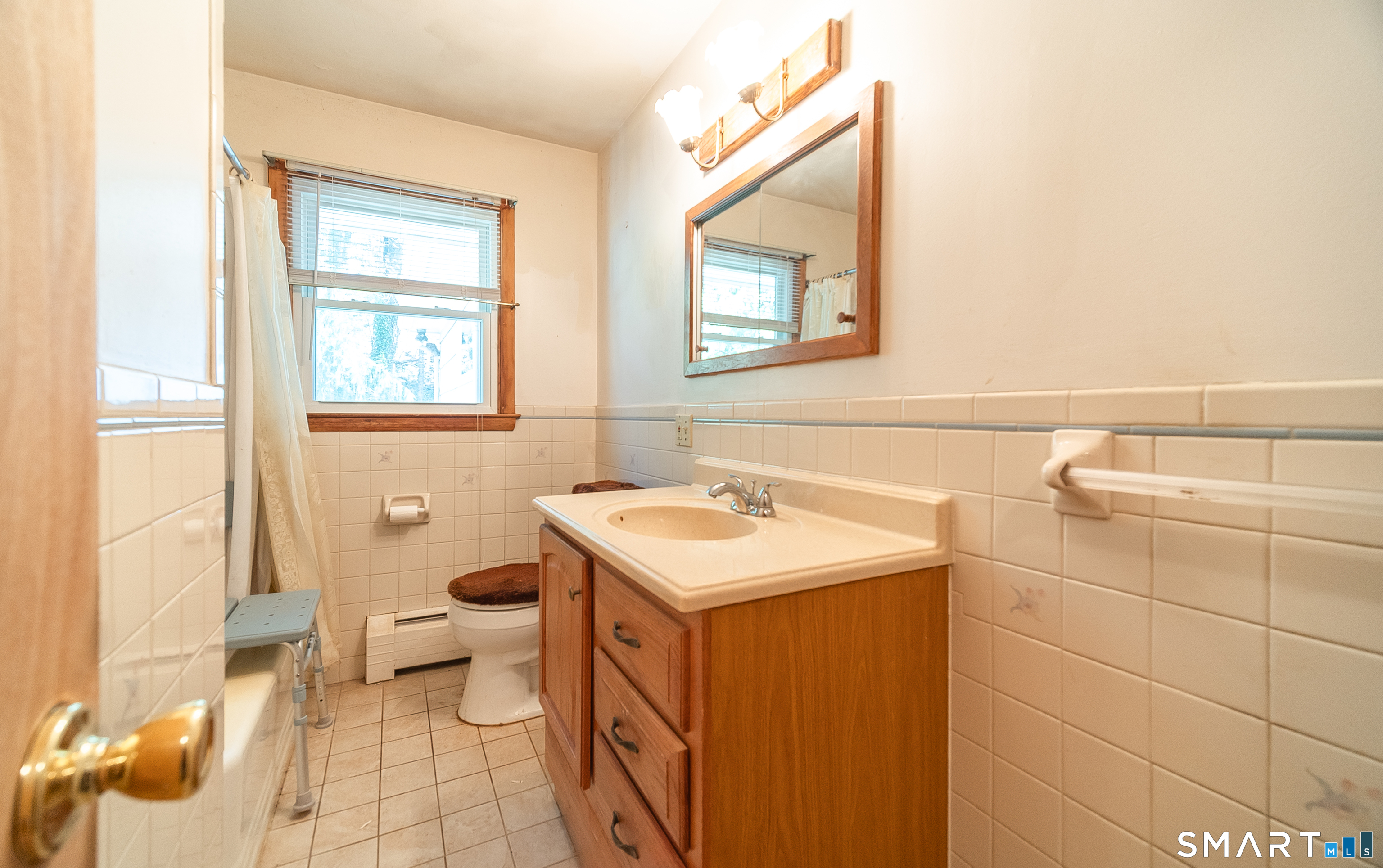 127 Bee Street Meriden, CT 06450 - Photo 22 of 32 a bathroom with a sink toilet and mirror