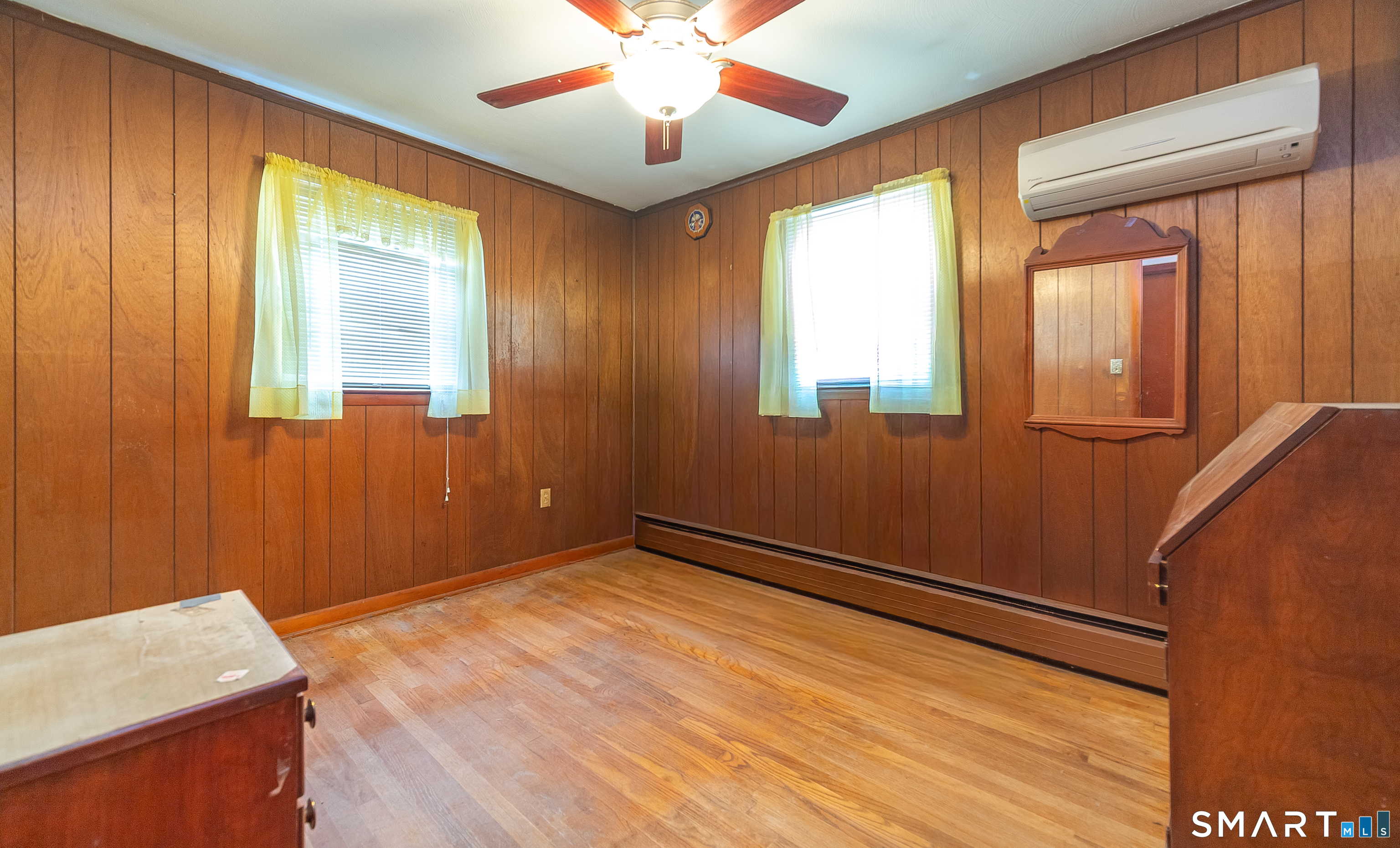 127 Bee Street Meriden, CT 06450 - Photo 25 of 32 a view of an empty room with window and wooden floor
