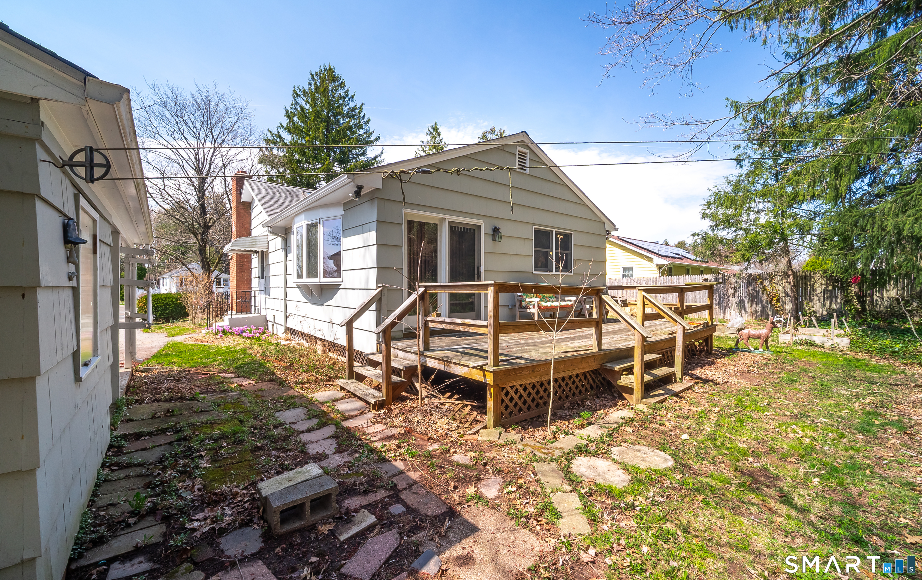 127 Bee Street Meriden, CT 06450 - Photo 30 of 32 a front view of a house with a yard table and chairs