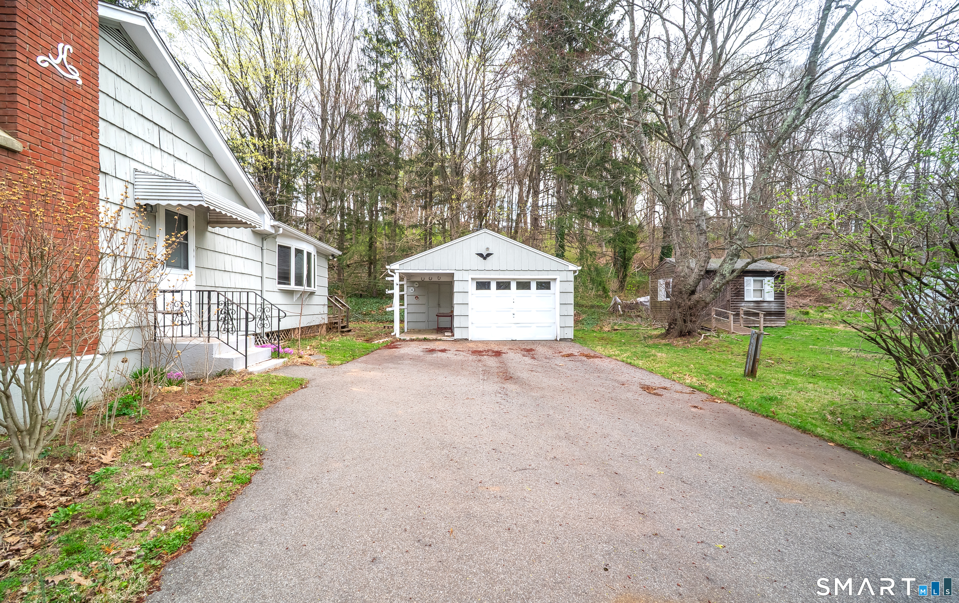 127 Bee Street Meriden, CT 06450 - Photo 5 of 32 a front view of a house with a yard and garage