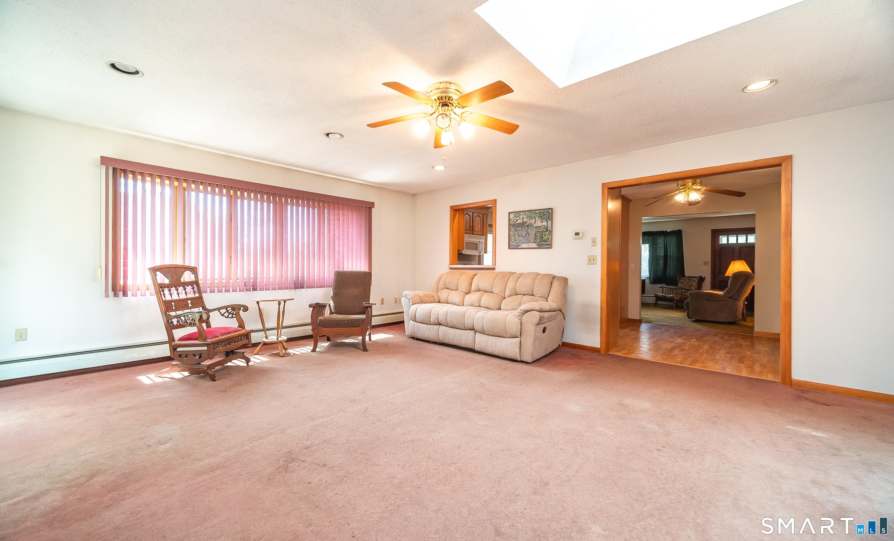 127 Bee Street Meriden, CT 06450 - Photo 7 of 32 a living room with furniture and a chandelier