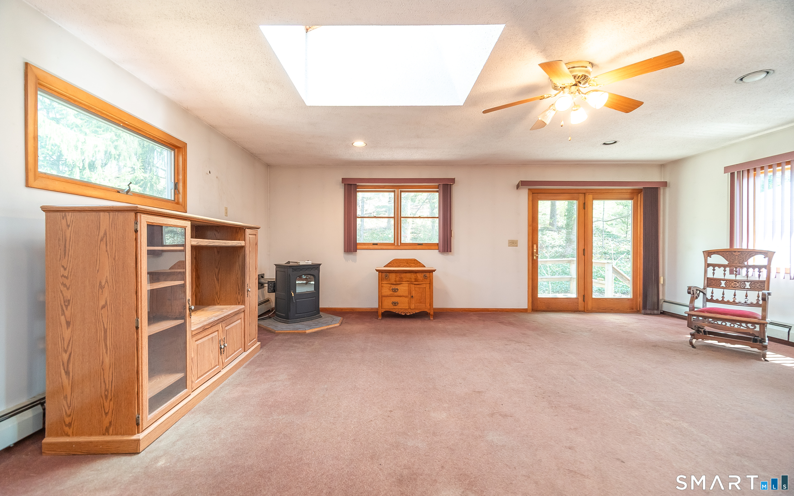 127 Bee Street Meriden, CT 06450 - Photo 9 of 32 a living room with furniture and a large window