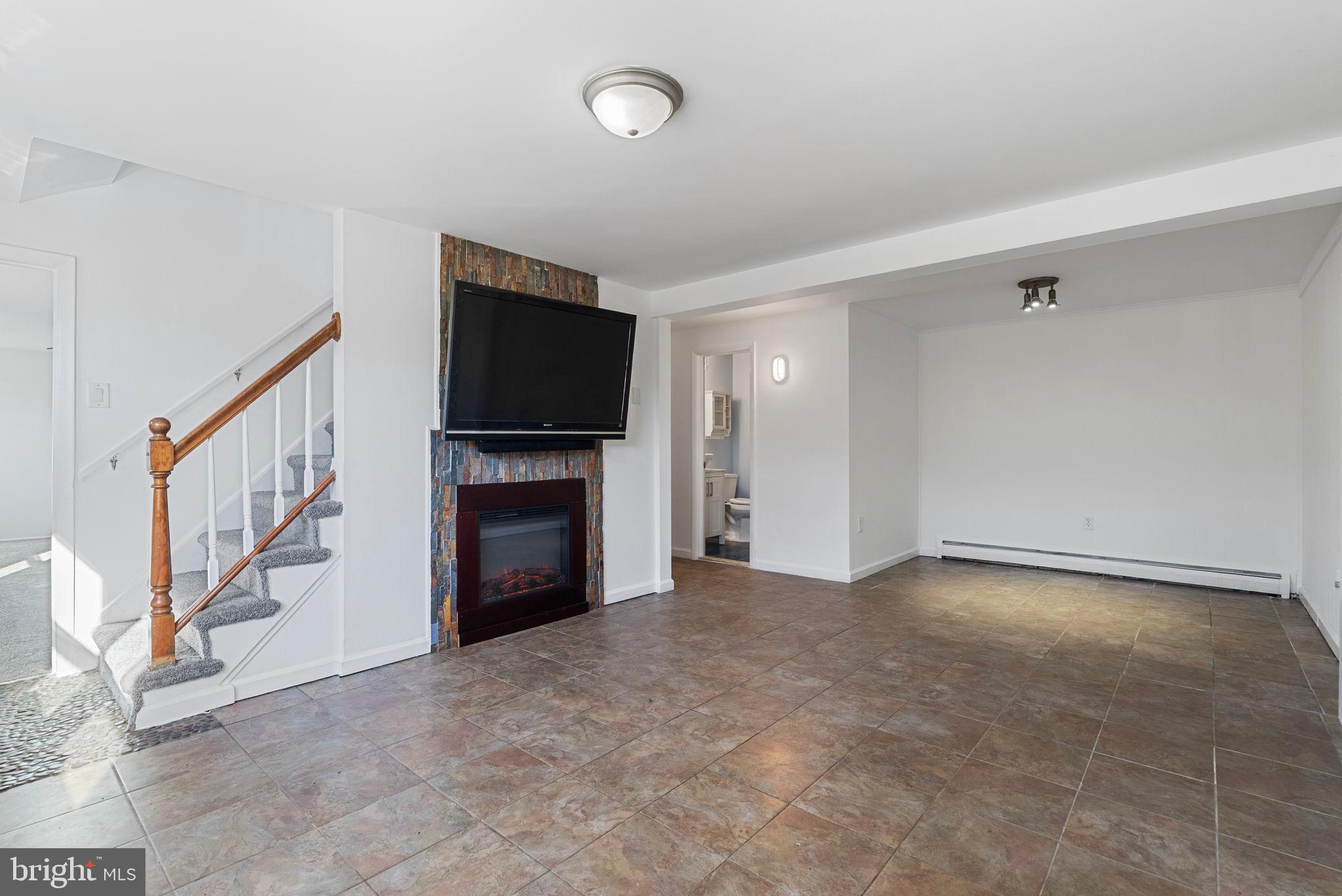 13421 Hillendale Drive Woodbridge, VA 22193 - Photo 2 of 28 a view of a livingroom with an empty space and a fireplace