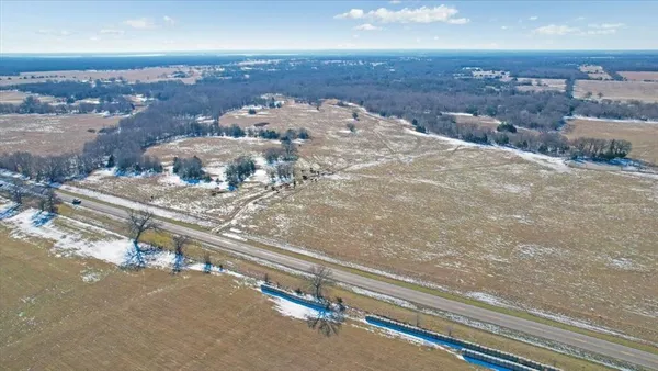 a view of a lake with a yard