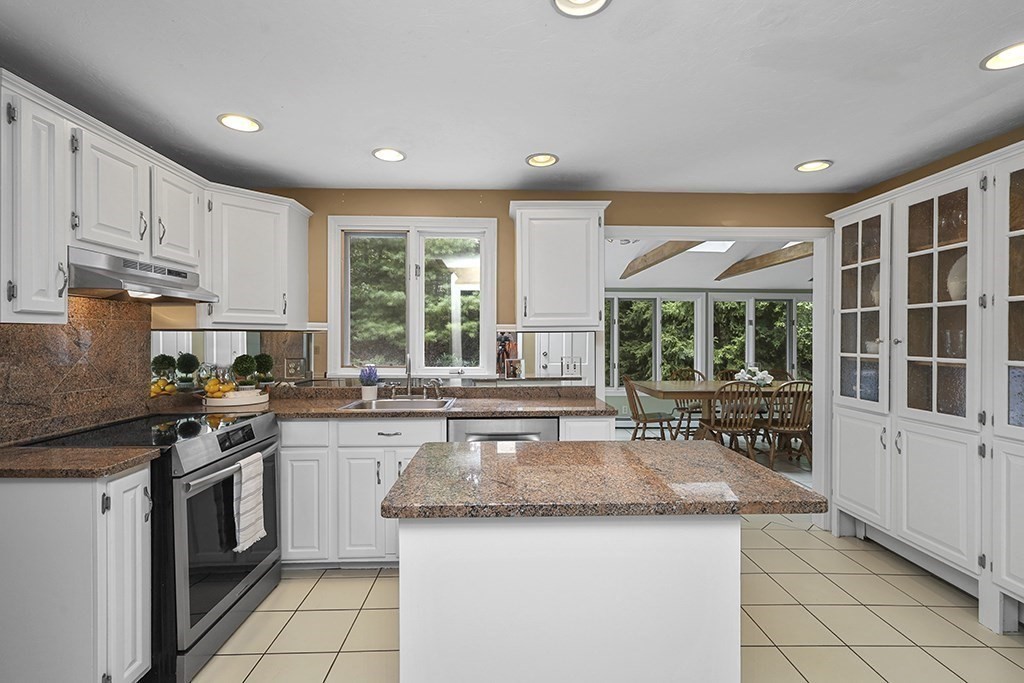 57 Vine Street North Attleboro, MA 02760 - Photo 18 of 41 a kitchen with stainless steel appliances granite countertop a stove a sink and a refrigerator