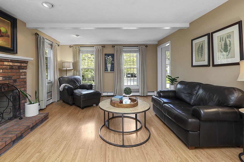 57 Vine Street North Attleboro, MA 02760 - Photo 25 of 41 a living room with furniture and a wooden floor