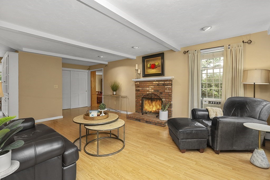 57 Vine Street North Attleboro, MA 02760 - Photo 27 of 41 a living room with furniture and a fireplace