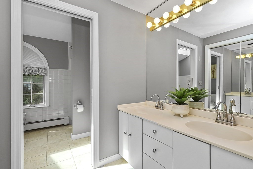 57 Vine Street North Attleboro, MA 02760 - Photo 30 of 41 a bathroom with a sink and a mirror