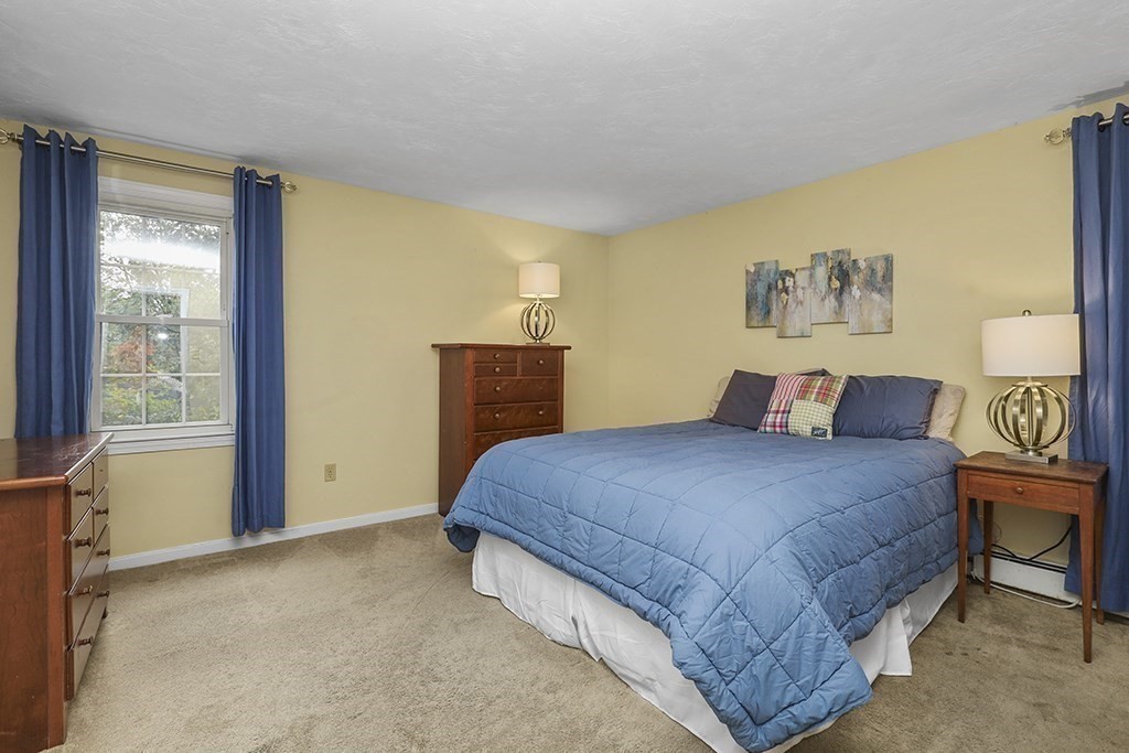 57 Vine Street North Attleboro, MA 02760 - Photo 33 of 41 a bedroom with a large bed and a window