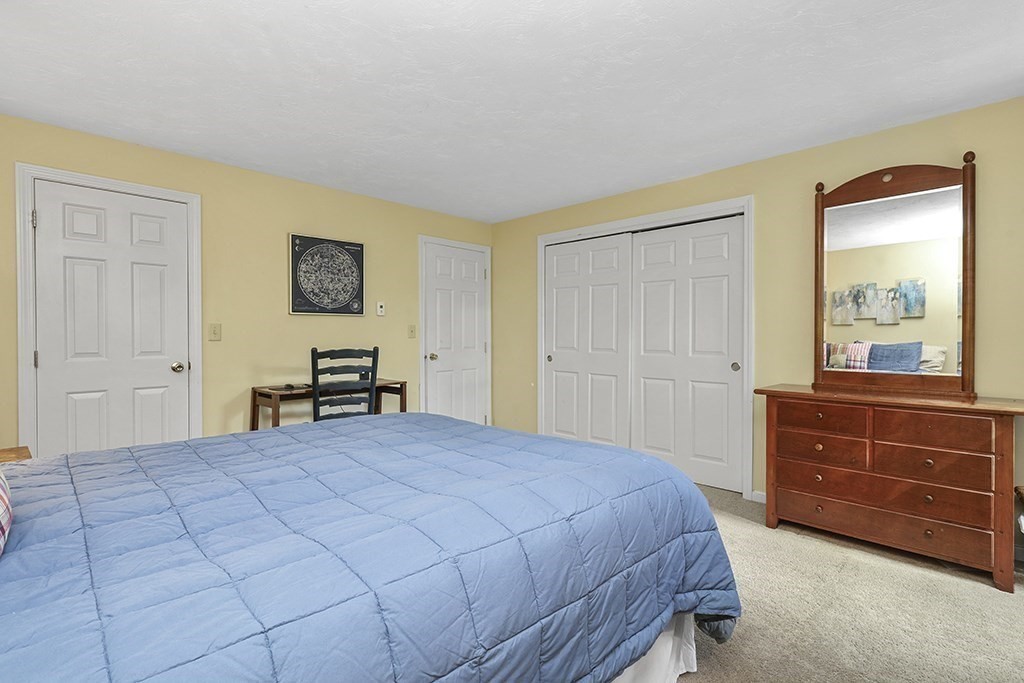 57 Vine Street North Attleboro, MA 02760 - Photo 34 of 41 a bedroom with a bed and a dresser in it
