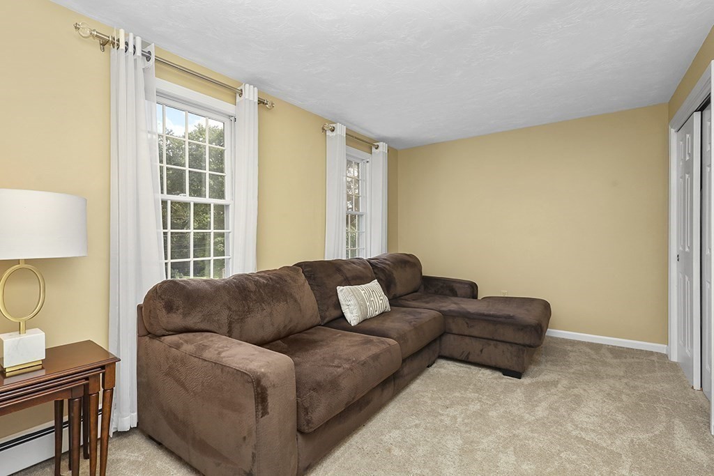 57 Vine Street North Attleboro, MA 02760 - Photo 36 of 41 a living room with furniture and a window