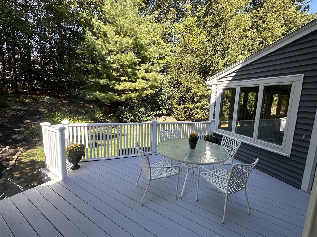 57 Vine Street North Attleboro, MA 02760 - Photo 9 of 41 a roof deck with table and chairs