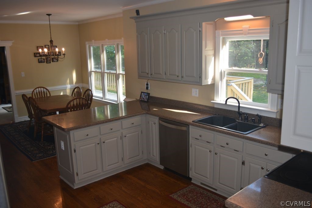 14101 Princess Mary Road Chesterfield, VA 23838 - Photo 13 of 44 a kitchen with granite countertop a sink window and cabinets
