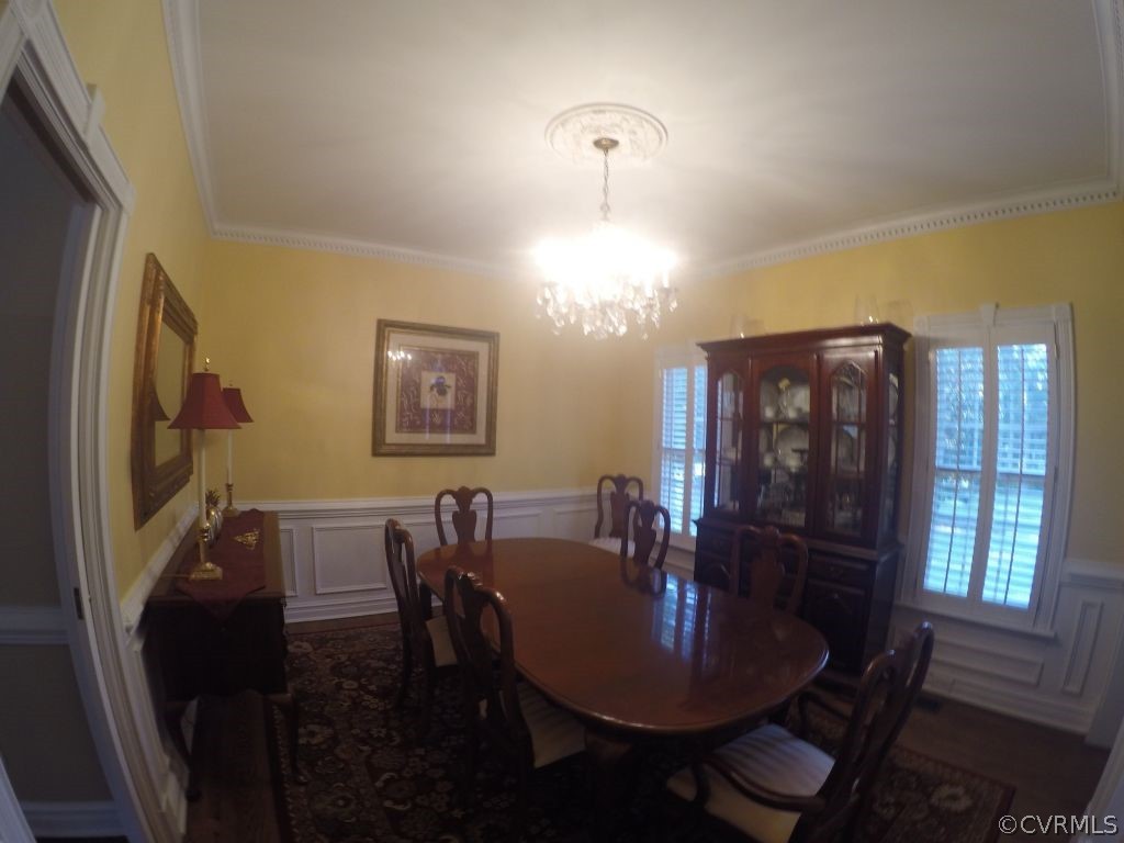 14101 Princess Mary Road Chesterfield, VA 23838 - Photo 15 of 44 a view of a dining room with furniture and chandelier