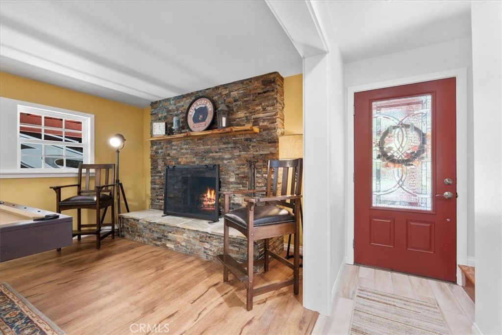 869 Mockingbird Road Wrightwood, CA 92397 - Photo 14 of 35 a living room with furniture and a fireplace