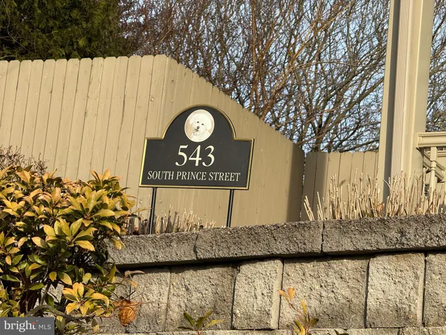 a view of a sign board with a small yard