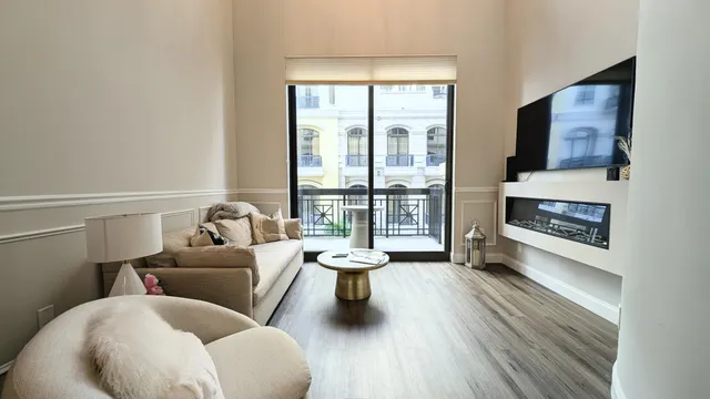 a living room with furniture and a fireplace