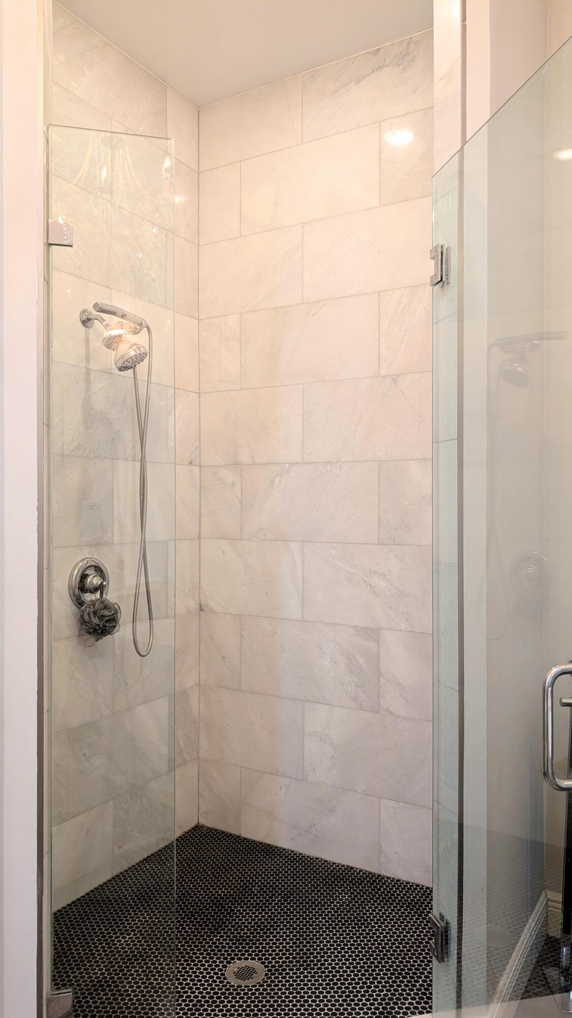 801 South Olive Avenue, Unit 435 West Palm Beach, FL 33401 - Photo 18 of 33 a bathroom with a shower
