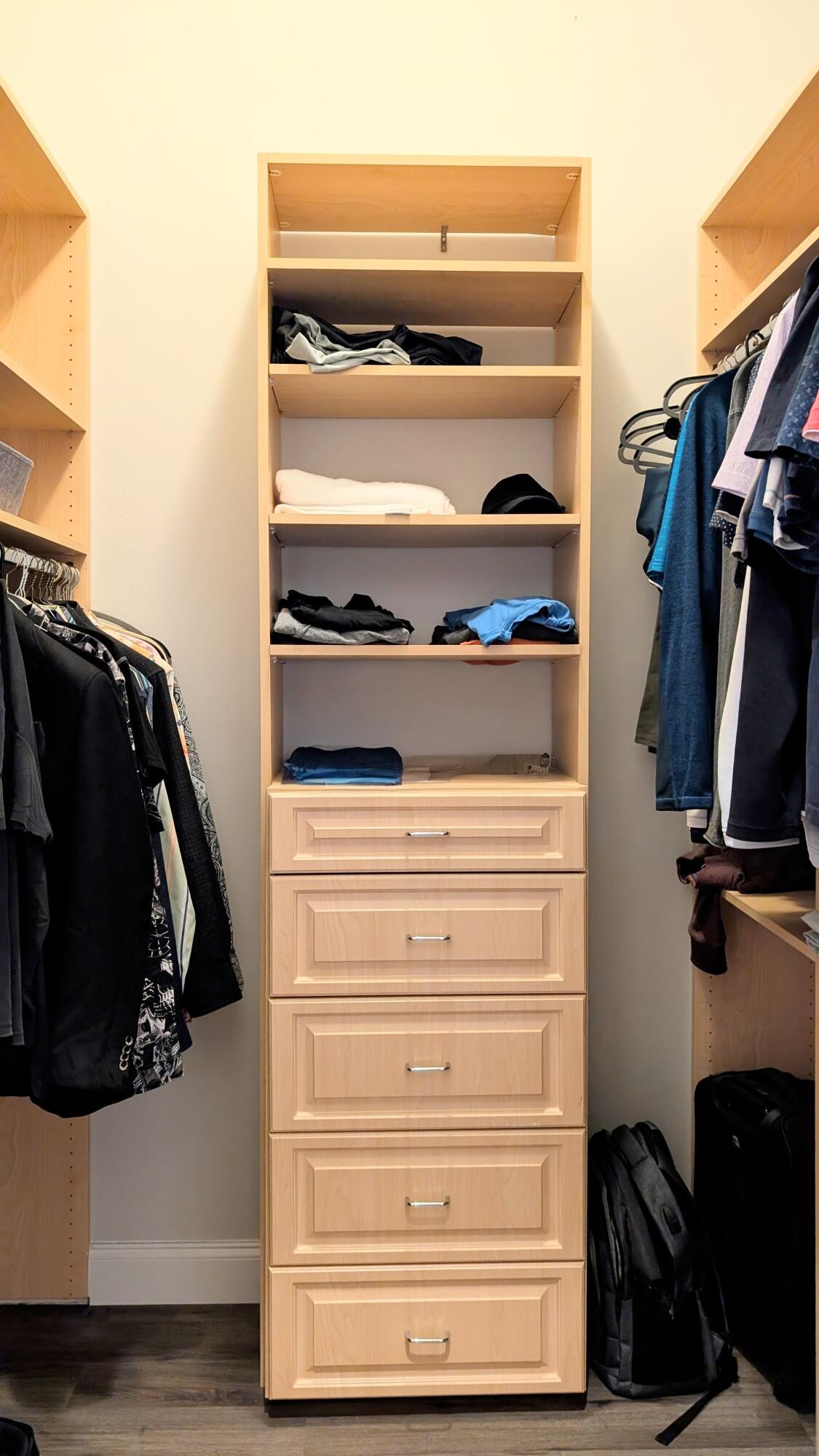 801 South Olive Avenue, Unit 435 West Palm Beach, FL 33401 - Photo 20 of 33 a view of walk in closet with clothes and shoes